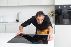 countertop installers tradesman checking kitchen surface countertop